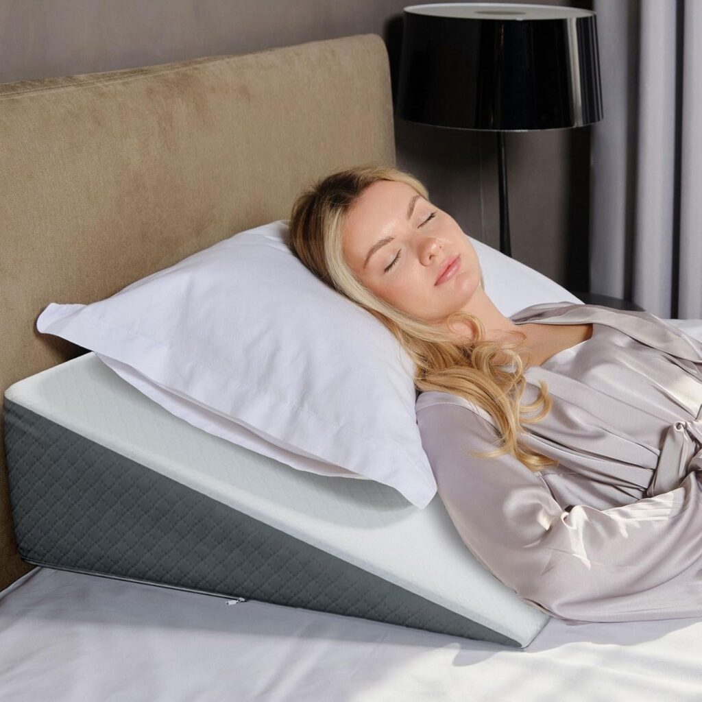 Bed wedge pillow placed on a bed to support elevated upper body positioning for comfort